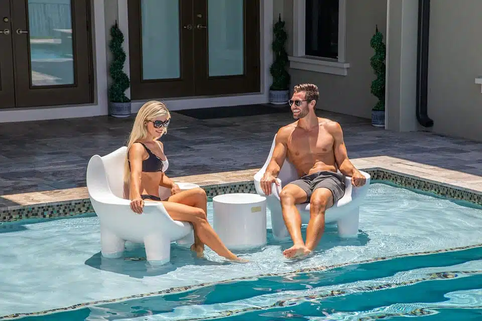 Couple Enjoying Poolside Comfort with Splash Ripple Side Table