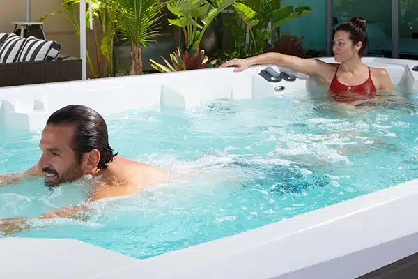 Couple Enjoying The Perks of a Swim Spa in Arizona