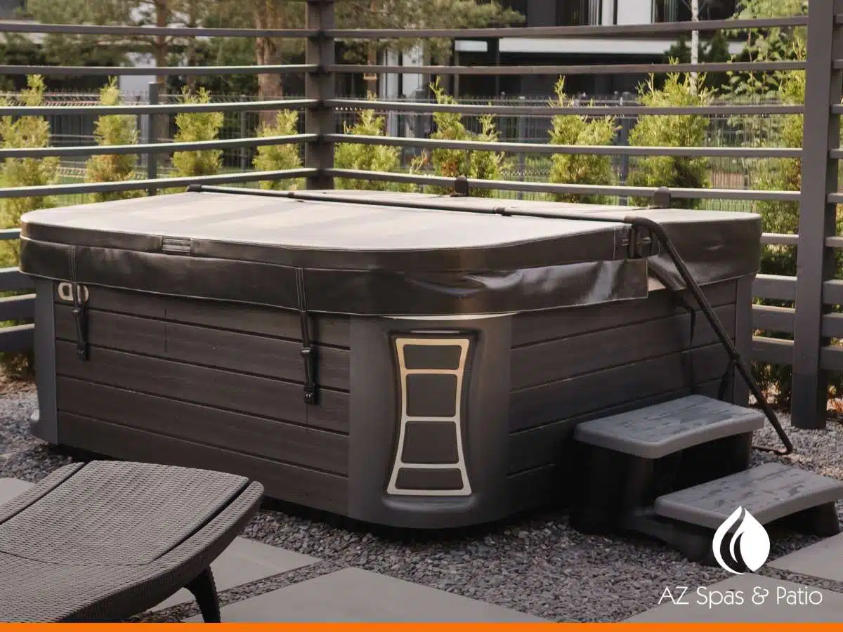 Modern Hot Tub with a cover lifter, steps, and a stylish outdoor setup